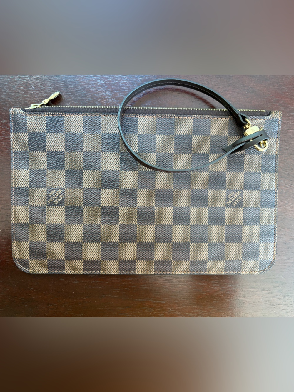 Never used Louis Vuitton Neverfull pouch